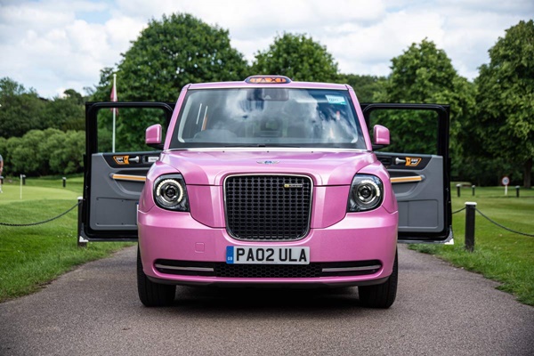 Pink Taxi outside stately home